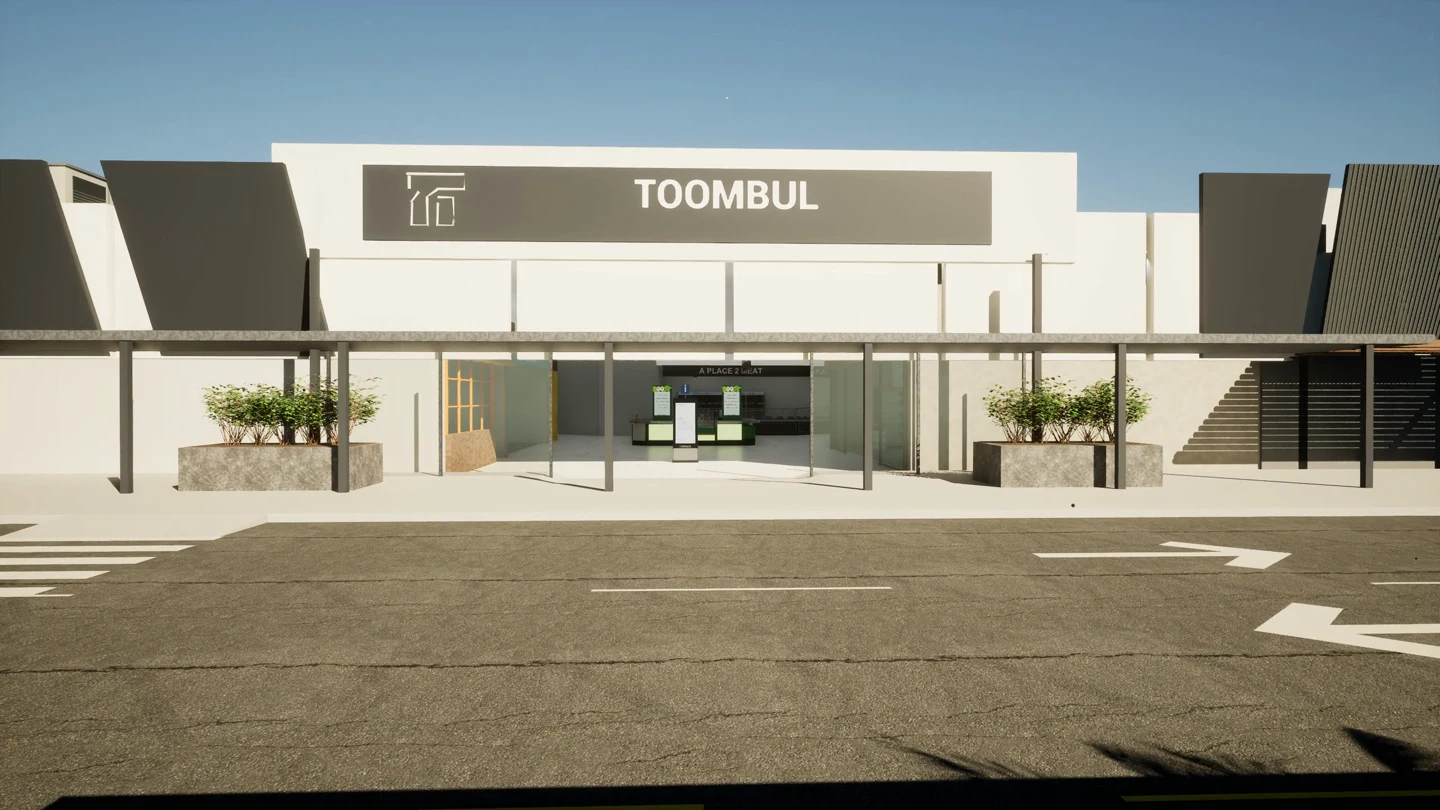 A ground-level view facing the western Toombul entrance, with the Toombul name and logo above the doors